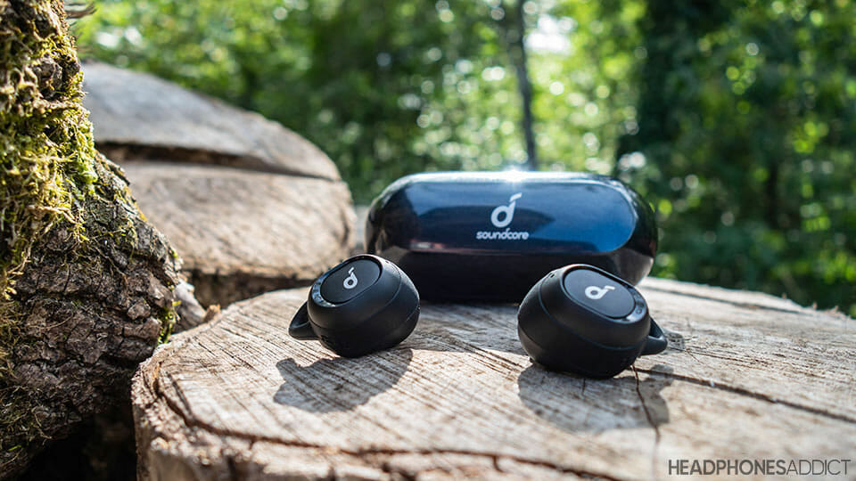 Anker Soundcore Liberty Neo on a wooden log
